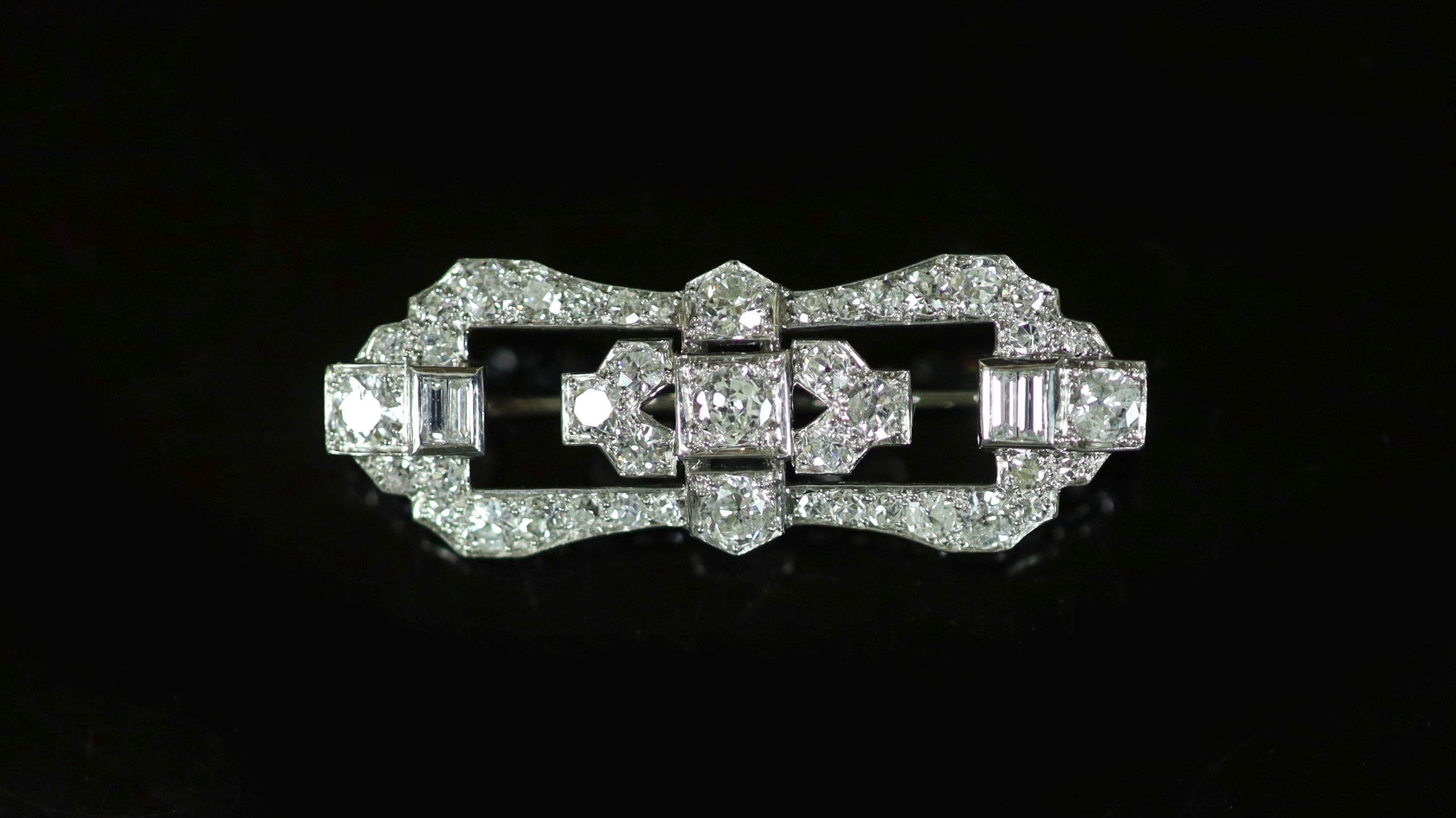 A 1940's/1950's platinum and diamond cluster set open work brooch